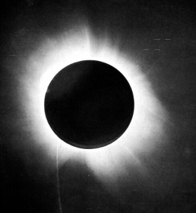 A black-and-white image of a total solar eclipse.
